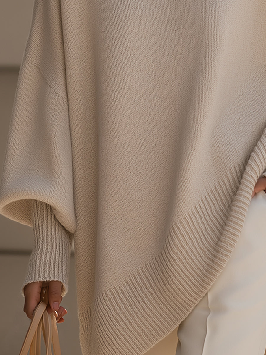 Women's oversized poncho jumper with asymmetric hem