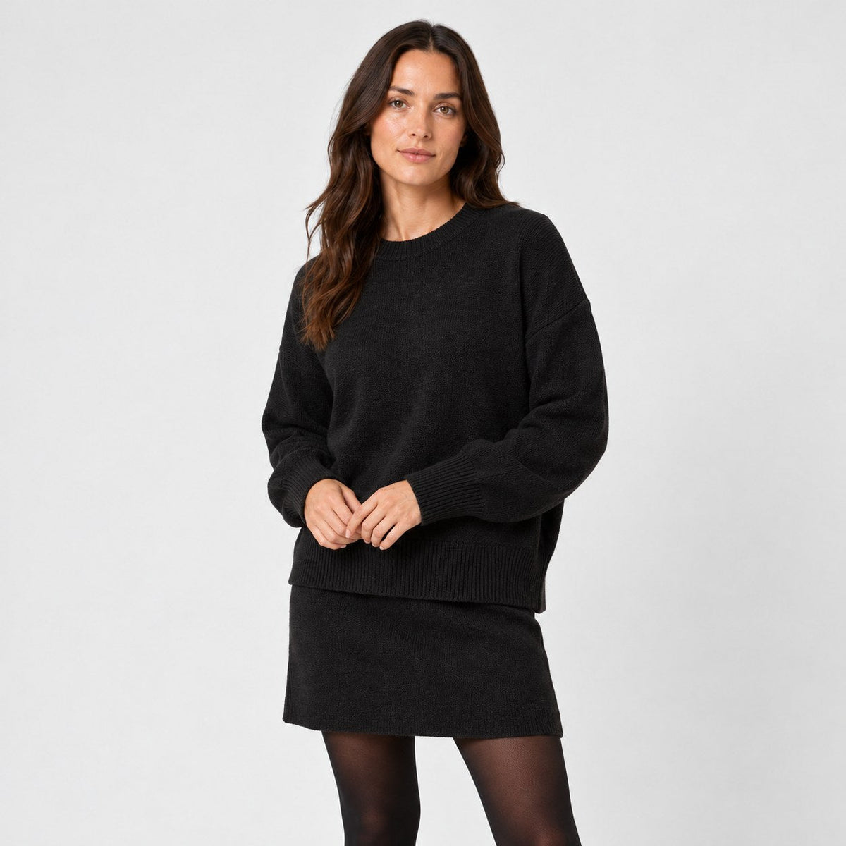 Women's jumper and mini skirt set in Black | Blisland – side view