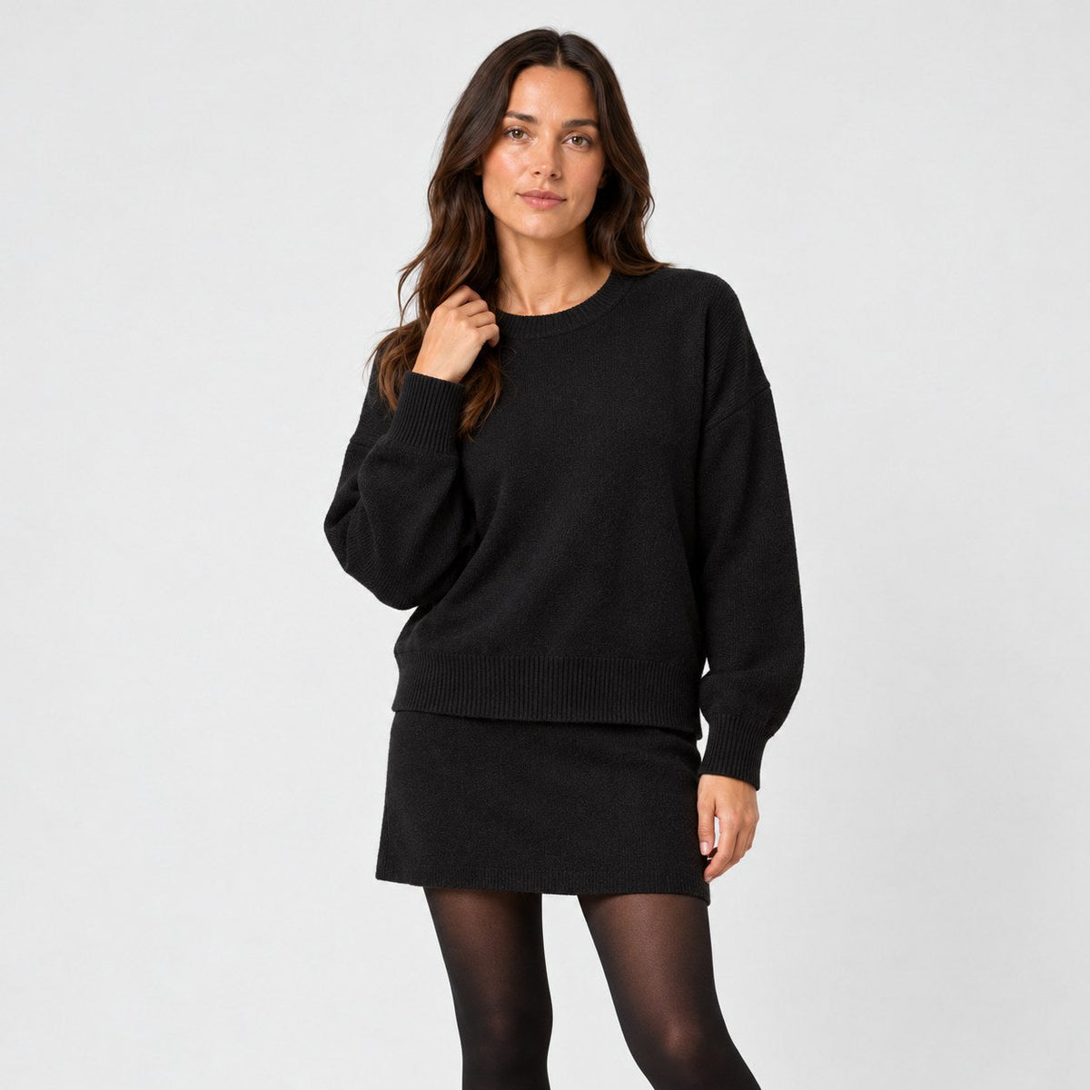 Women's jumper and mini skirt set in Black | Blisland – front view