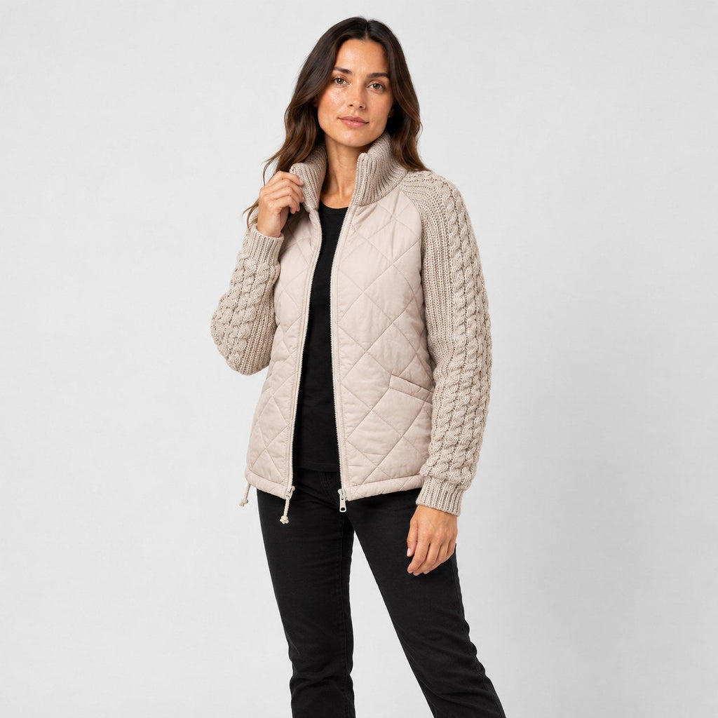Women's quilted jacket with cable knit sleeves in Beige | Luxulyan – side view