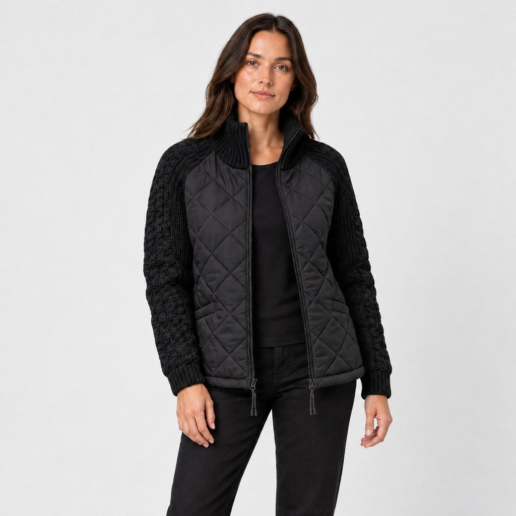 Women's quilted jacket with cable knit sleeves in Black | Luxulyan – front view