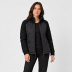 Women's quilted jacket with cable knit sleeves in Black | Luxulyan – front view