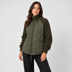 Women's quilted jacket with cable knit sleeves in Olive Green | Luxulyan – side view