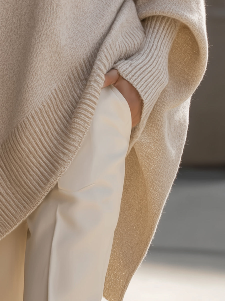 Women's oversized poncho jumper with asymmetric hem