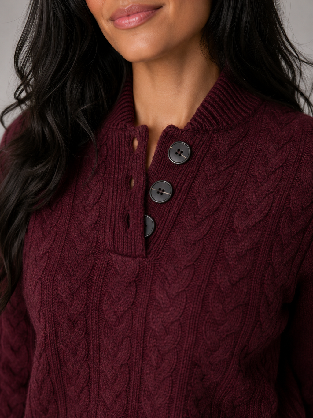 Women's cable knit jumper with buttoned neck