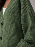 Women's oversized chunky knit cardigan with a V-neck and pockets