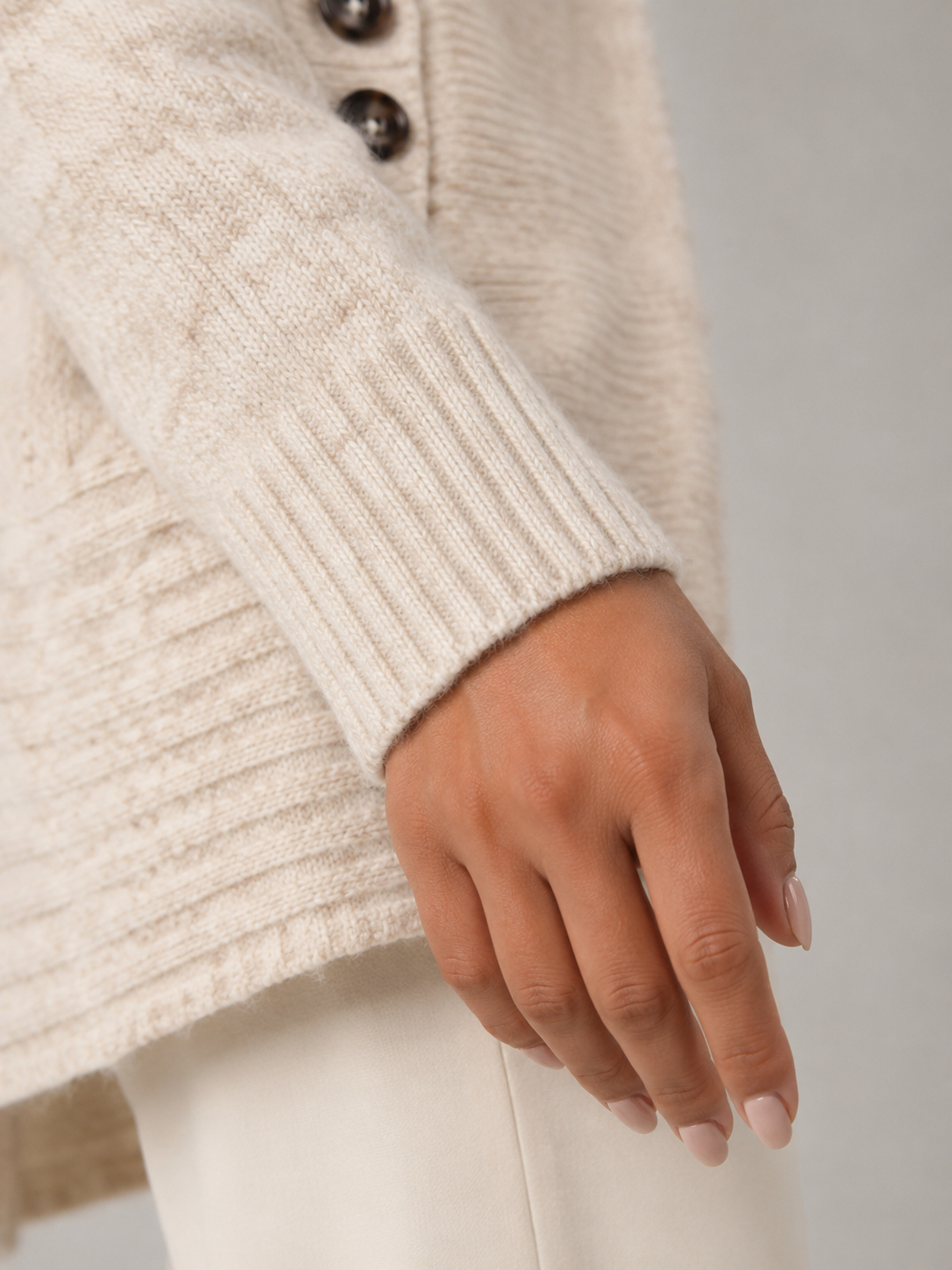 Women's shawl collar cardigan with a button-tab waist