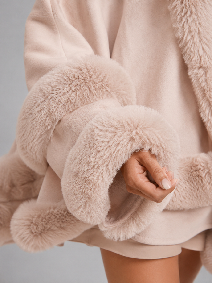Women's cape cardigan with faux fur trim