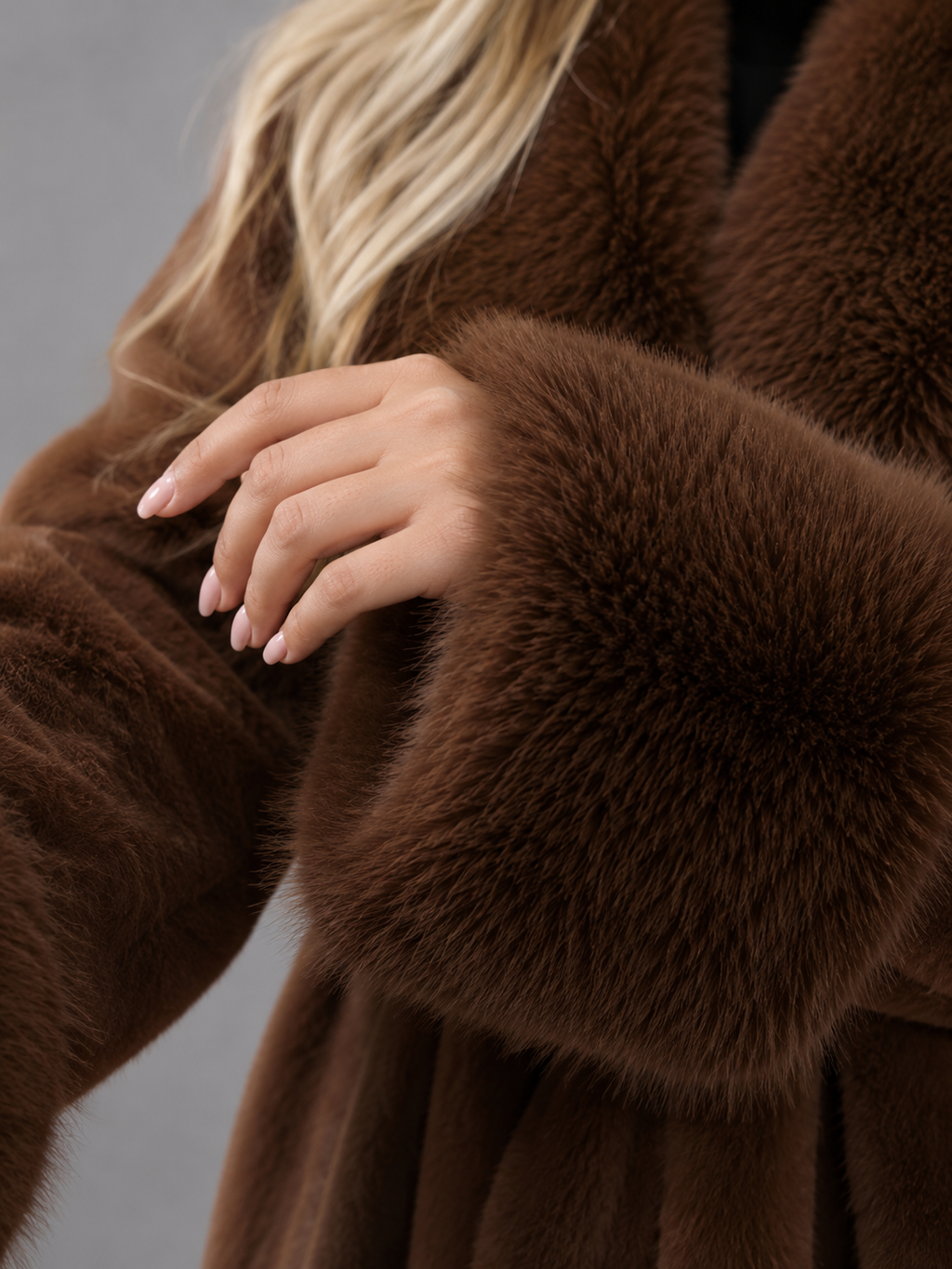 Women's belted coat with a faux fur shawl collar and cuffs