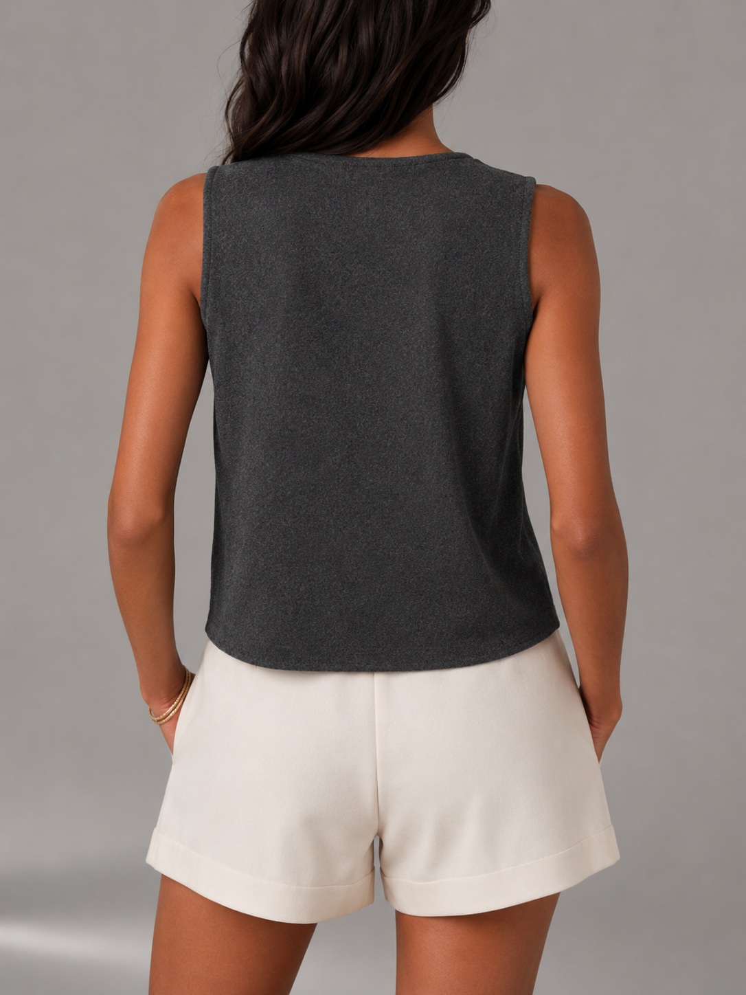 Women's sleeveless knitted waistcoat with a button front