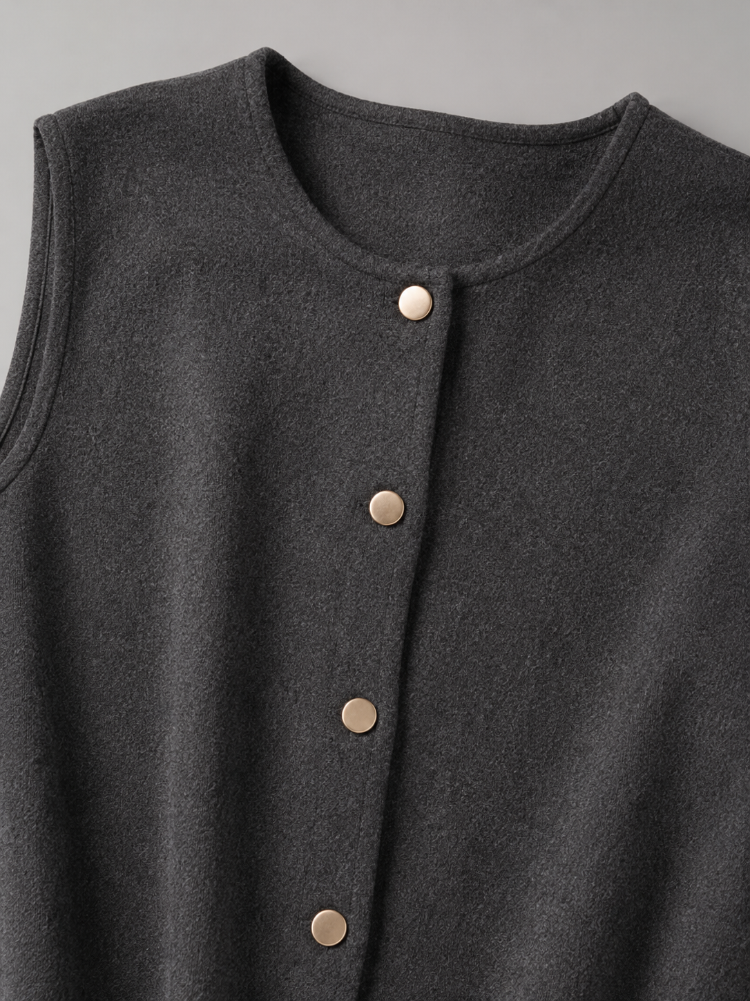 Women's sleeveless knitted waistcoat with a button front