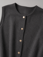 Women's sleeveless knitted waistcoat with a button front