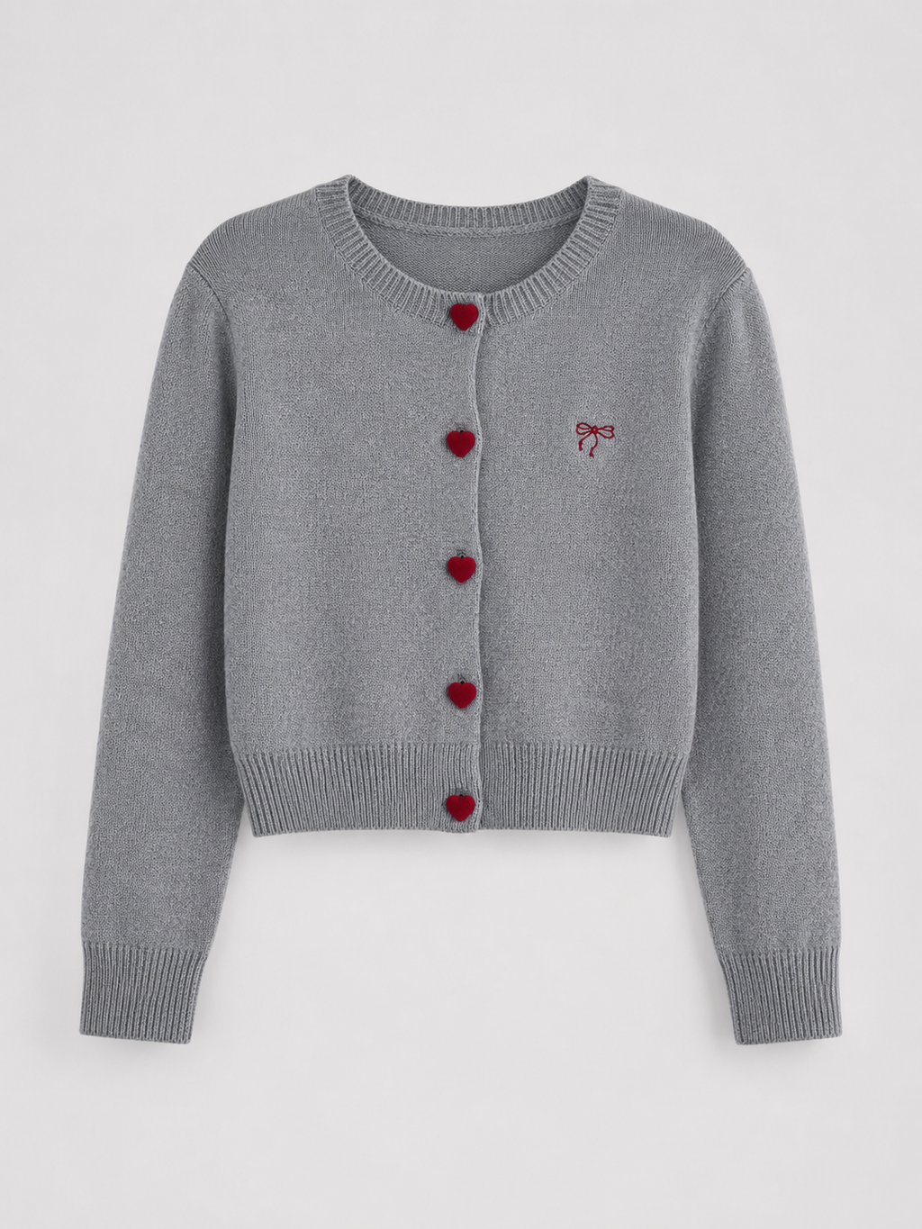 Women's knit cardigan with an embroidered bow and heart-shaped buttons