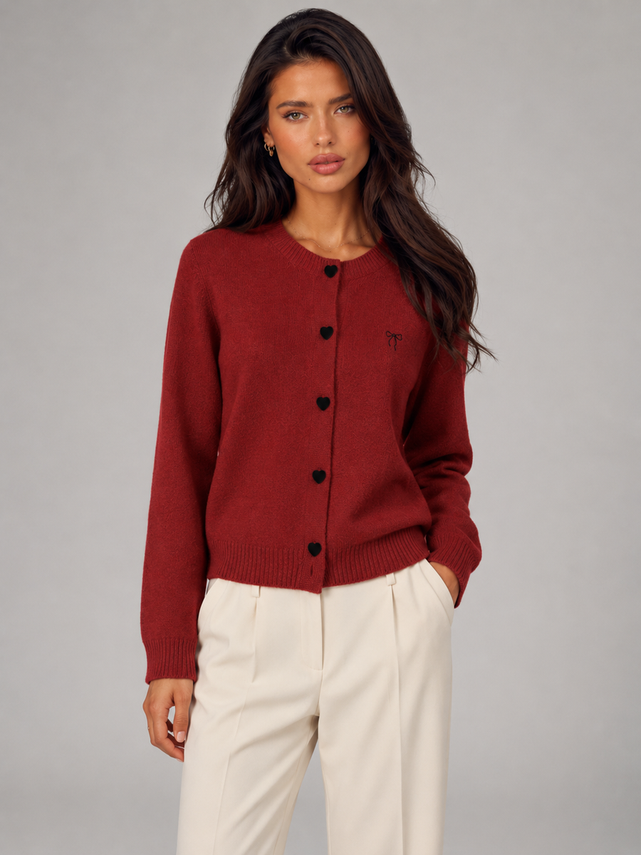 Women's knit cardigan with an embroidered bow and heart-shaped buttons