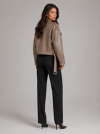 Women's oversized faux leather biker jacket with a belt