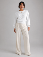 Women's cable knit jumper with lantern sleeves and a ribbed waist