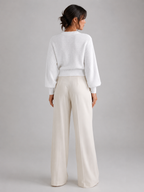 Women's cable knit jumper with lantern sleeves and a ribbed waist