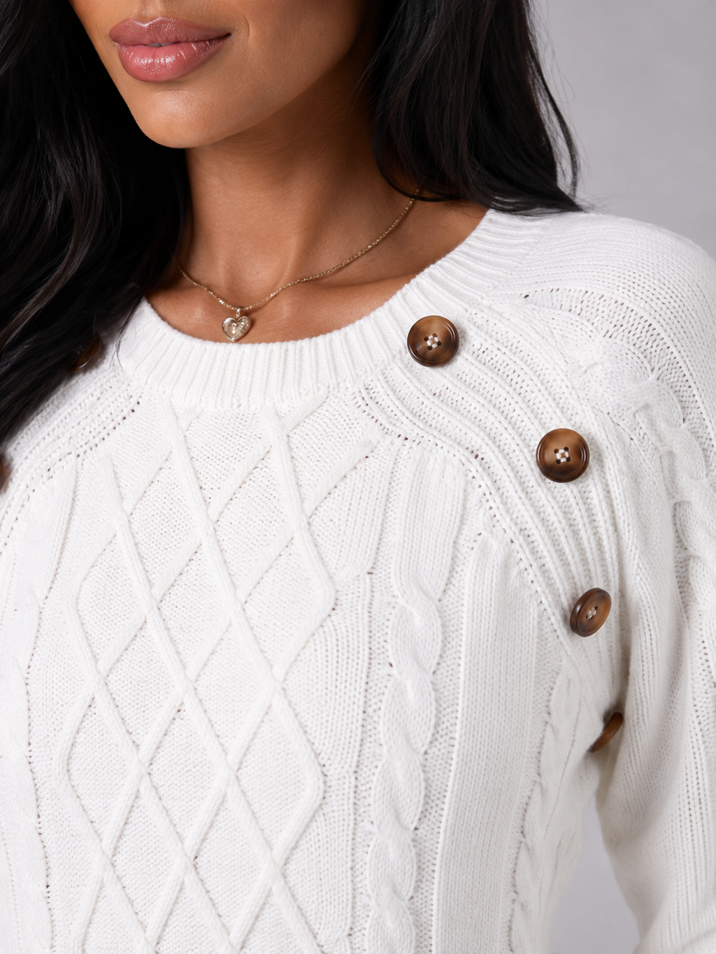 Women's cable knit jumper with buttons at the shoulder seam