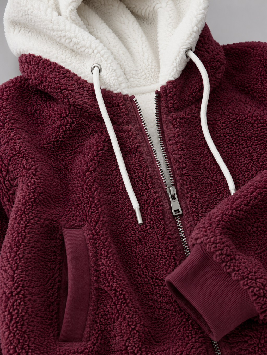 Women's sherpa-lined hooded padded jacket with a zip front