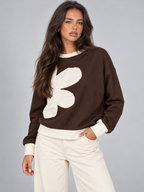 Women's sweatshirt with an oversized floral appliqué