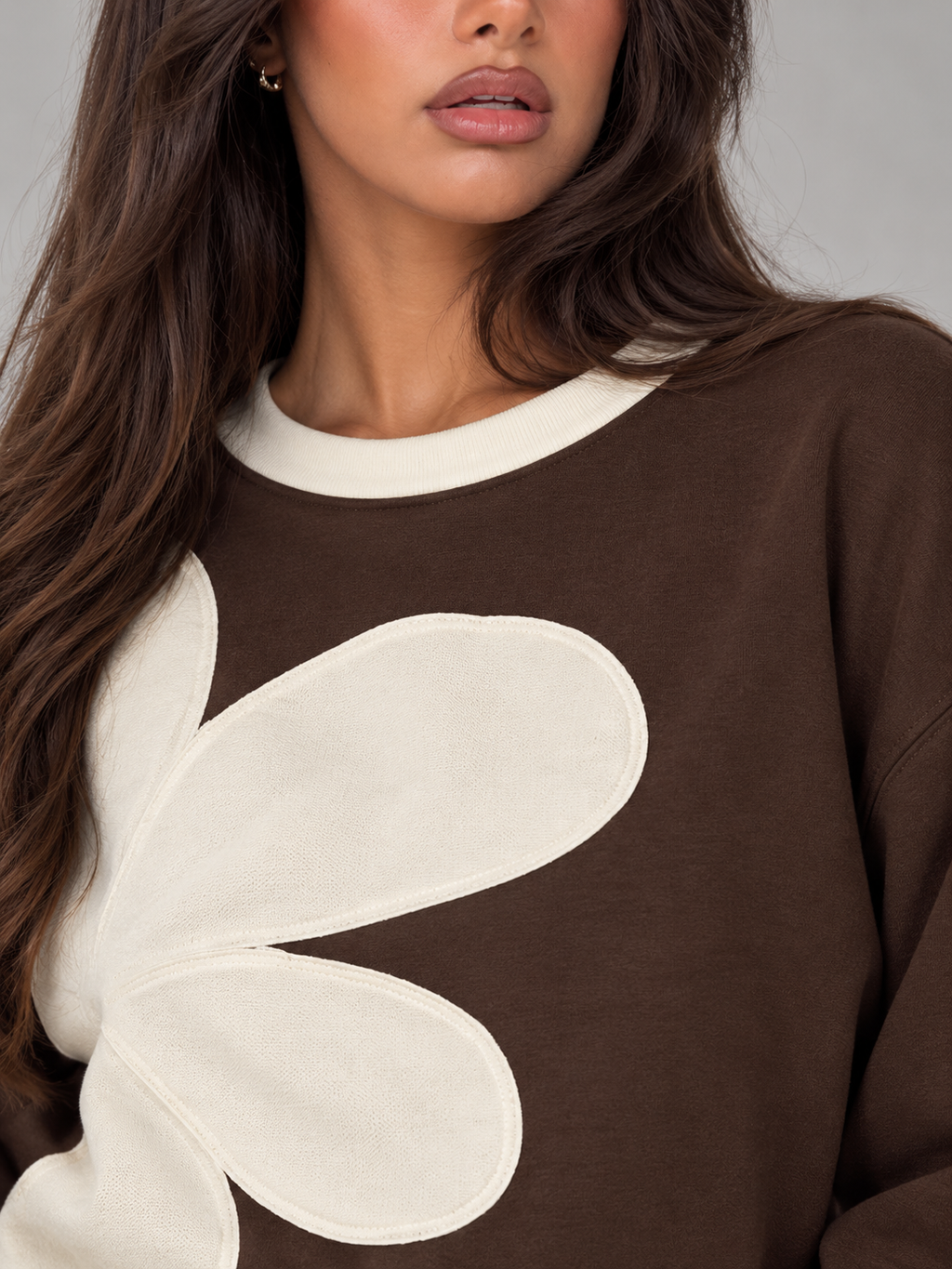Women's sweatshirt with an oversized floral appliqué