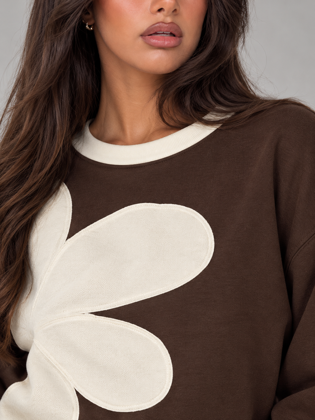 Women's sweatshirt with an oversized floral appliqué