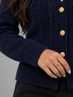 Women's cable knit cardigan with a deep V-neck and gold-tone buttons