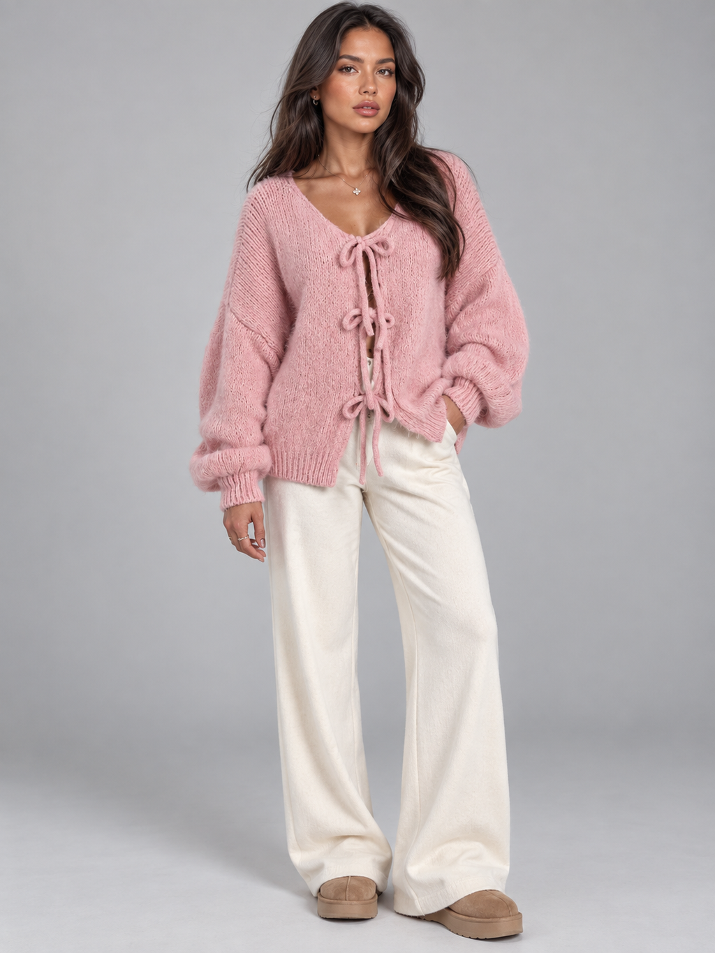 Women's open knit cardigan with tie-bow fastenings and balloon sleeves