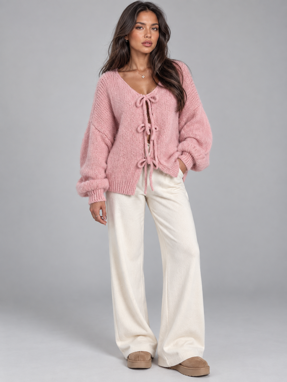 Women's open knit cardigan with tie-bow fastenings and balloon sleeves