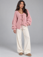 Women's open knit cardigan with tie-bow fastenings and balloon sleeves