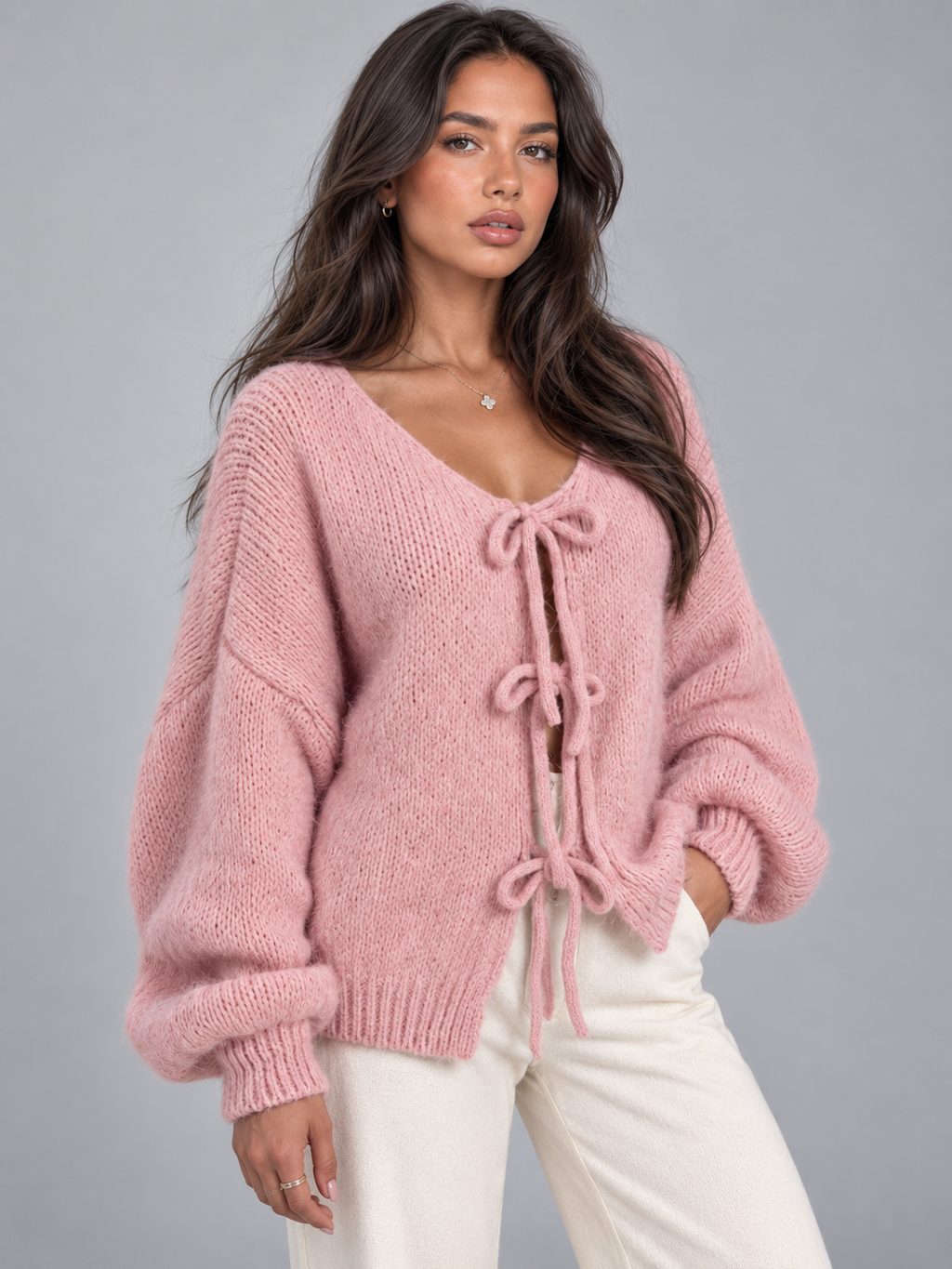 Women's open knit cardigan with tie-bow fastenings and balloon sleeves