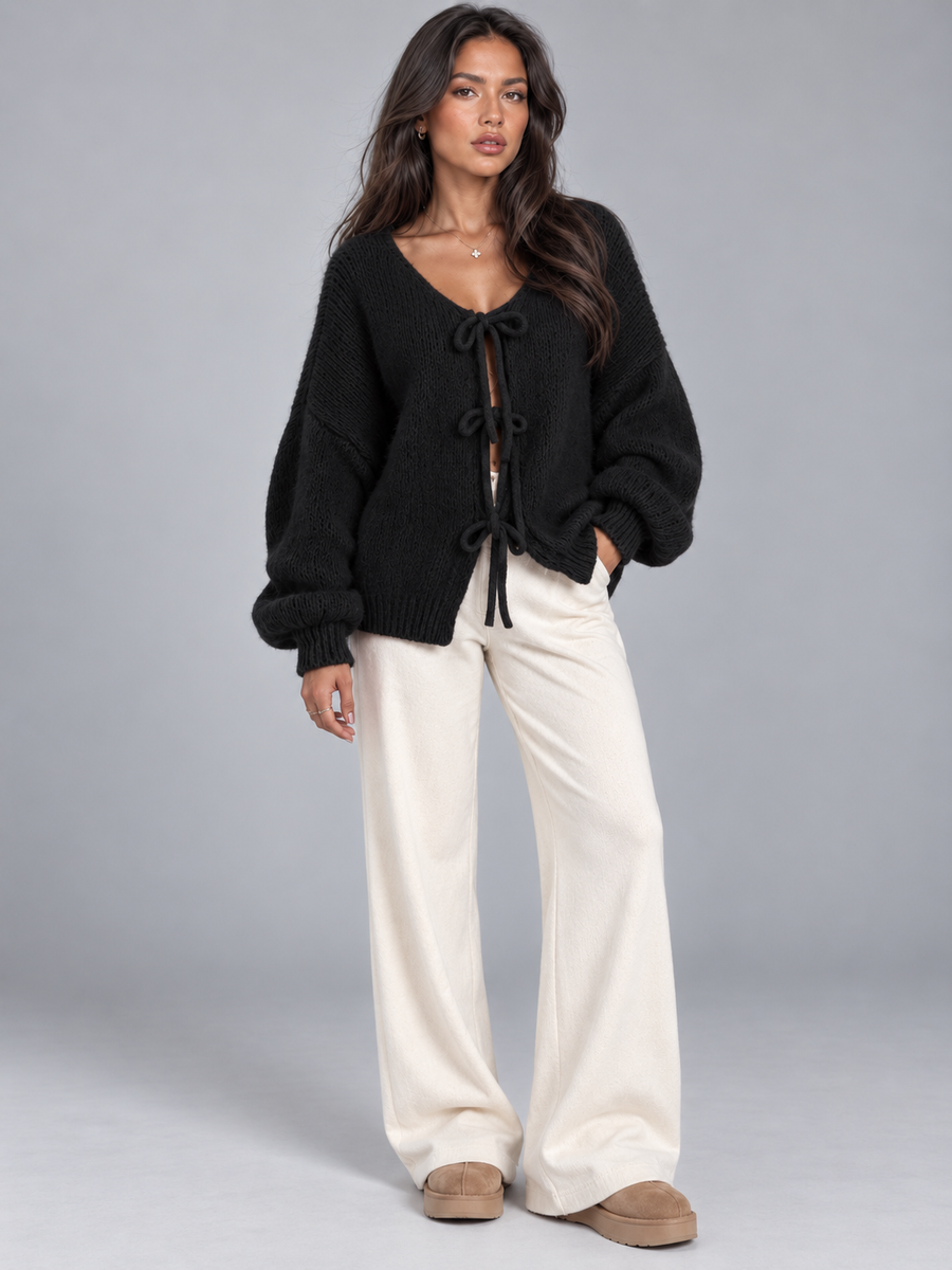 Women's open knit cardigan with tie-bow fastenings and balloon sleeves