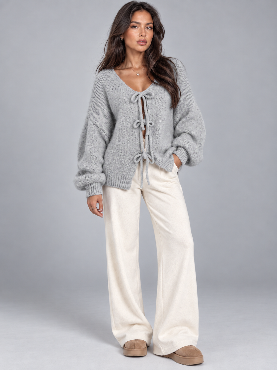 Women's open knit cardigan with tie-bow fastenings and balloon sleeves