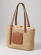 Women's woven straw tote bag with leather-look straps