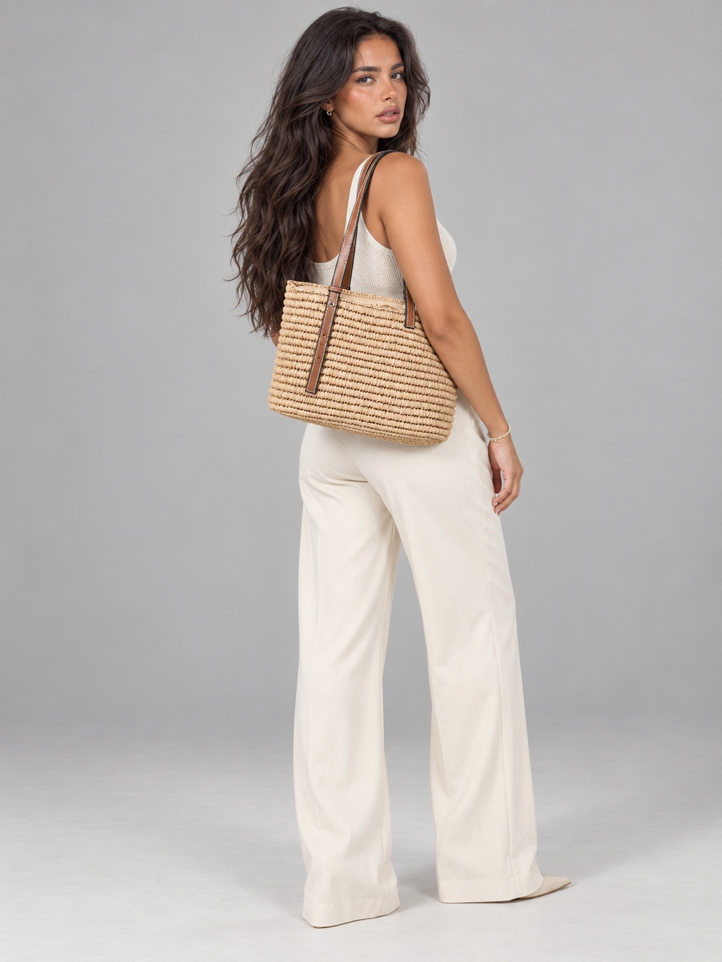 Women's woven straw tote bag with leather-look straps
