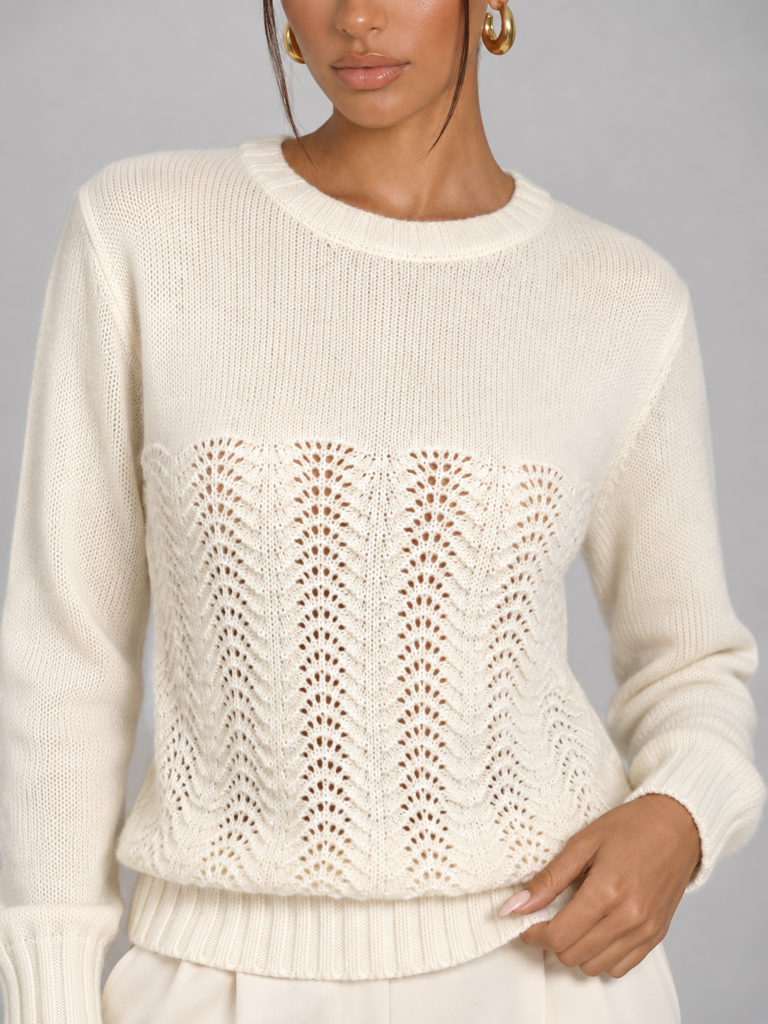 Women's pointelle open stitch knit jumper with a crew neck