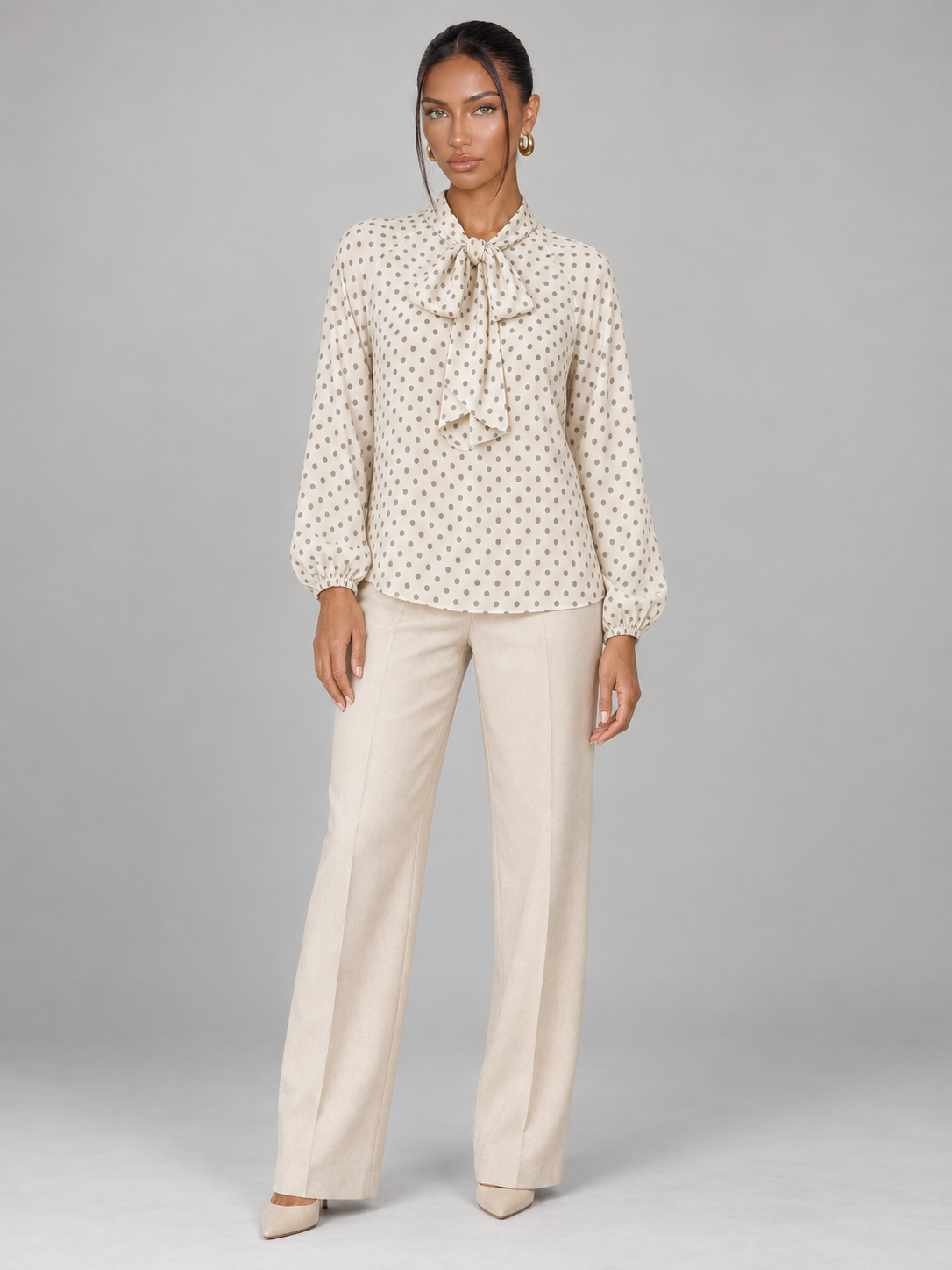 Women's polka dot blouse with a pussy bow tie neck