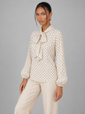 Women's polka dot blouse with a pussy bow tie neck