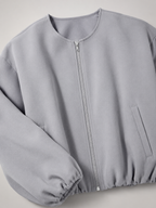 Women's cropped bomber jacket with balloon sleeves and a zip front