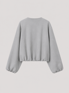 Women's cropped bomber jacket with balloon sleeves and a zip front