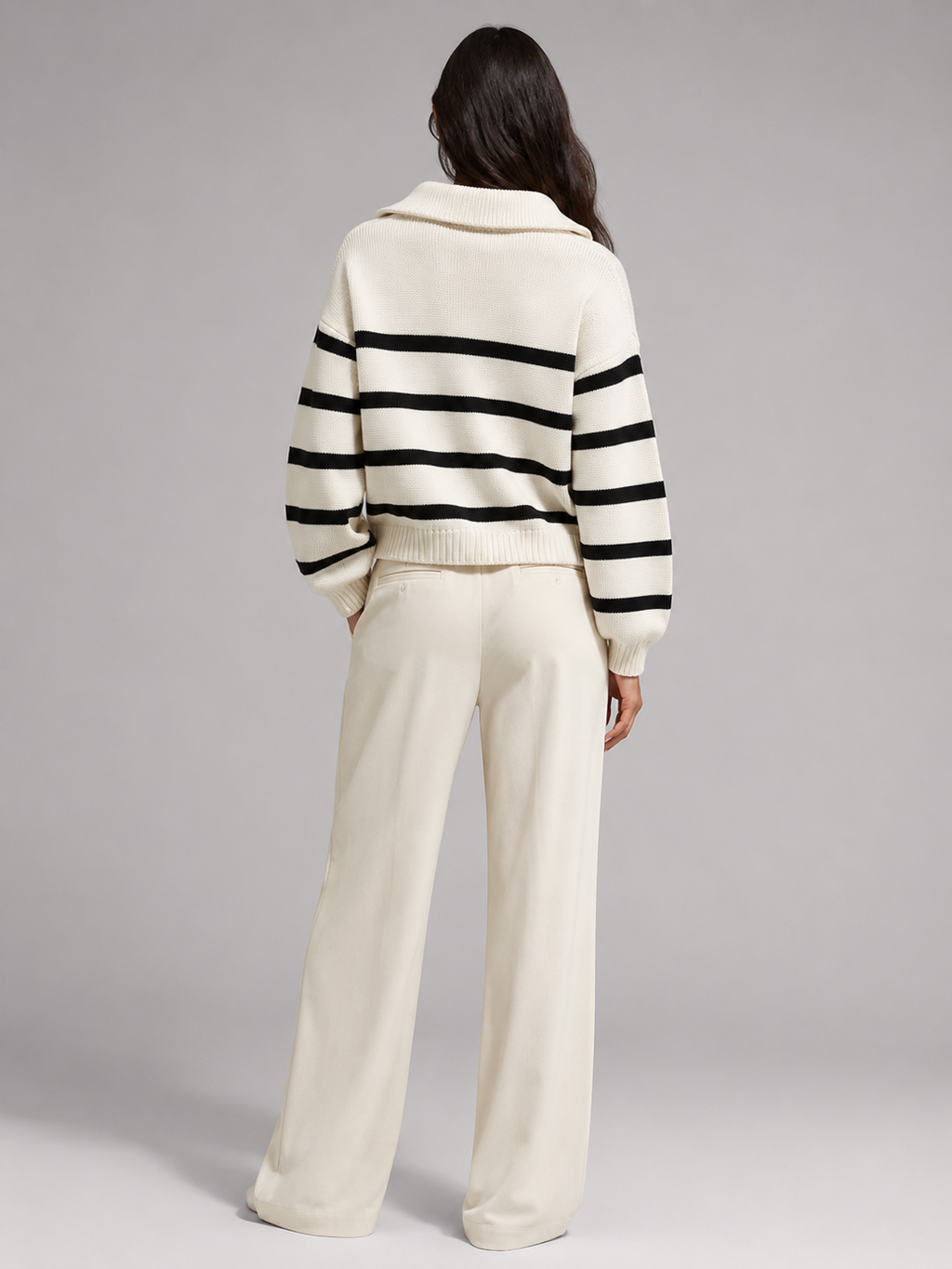 Women's striped knit jumper with a high neck and half zip