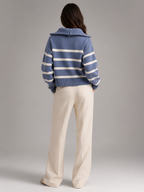 Women's striped knit jumper with a high neck and half zip