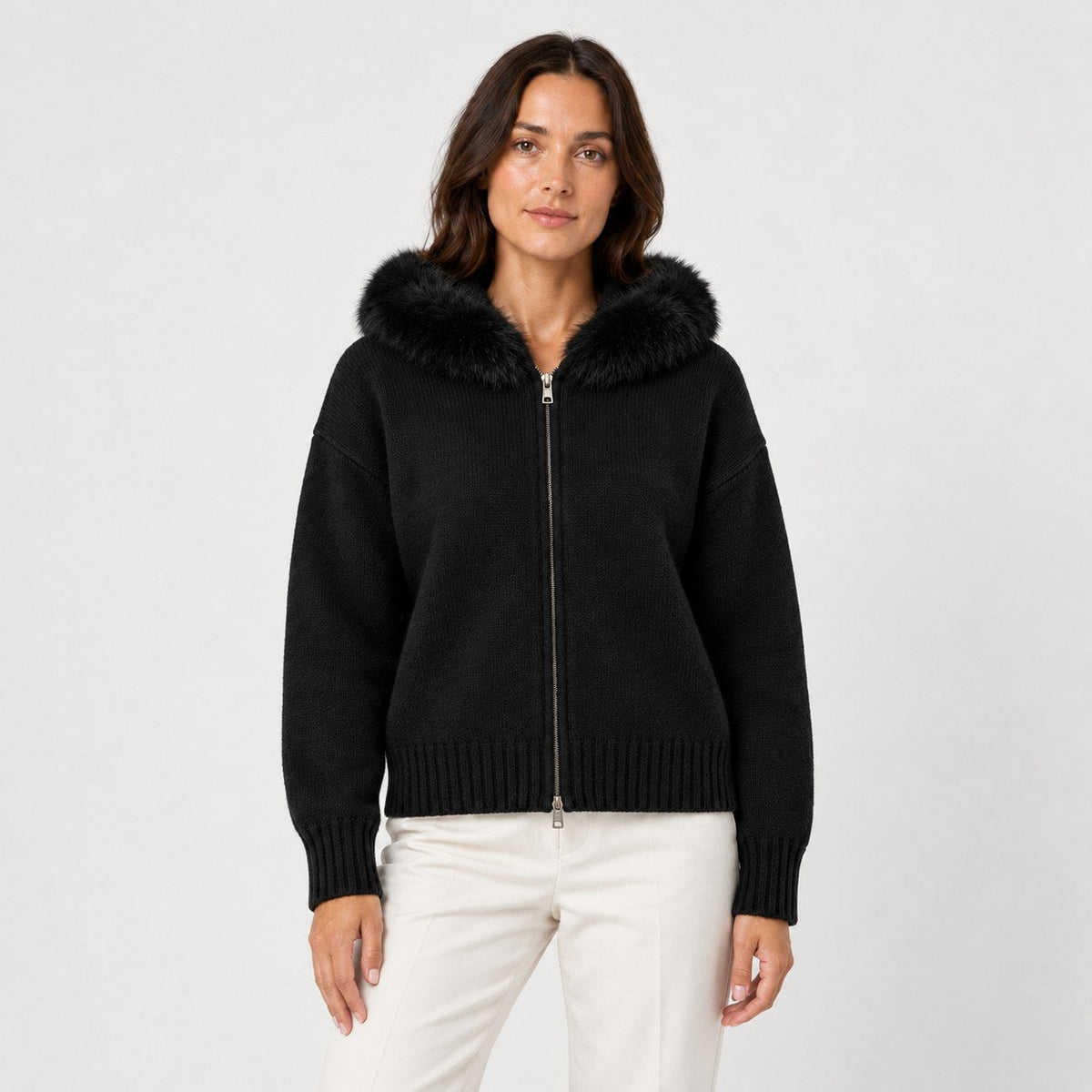 Women's zip-up knit cardigan with faux fur hood in Black | Kilnsey – front view