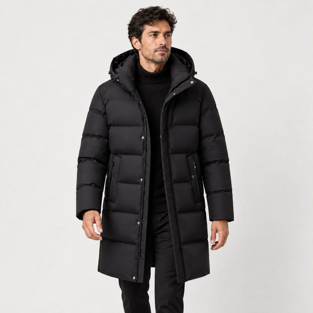 Men's longline hooded puffer coat in Black | Rhossili – front view