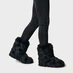 Women's fluffy faux fur boots in Black | Goadby – side view