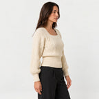 Women's cropped cable knit jumper with puff sleeves in Cream | Ickleton – side view