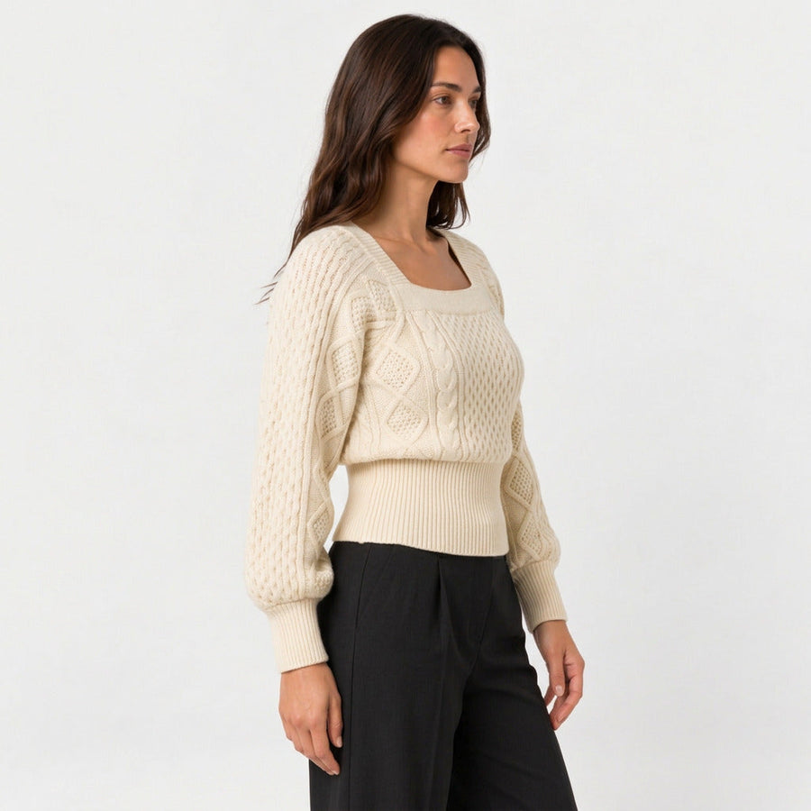 Women's cropped cable knit jumper with puff sleeves in Cream | Ickleton – side view
