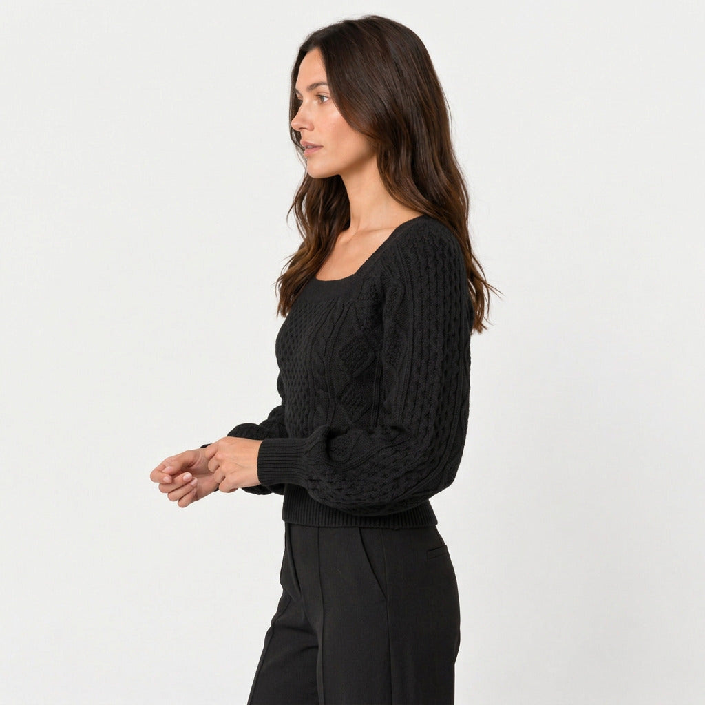 Women's cropped cable knit jumper with puff sleeves in Black | Ickleton – side view