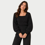 Women's cropped cable knit jumper with puff sleeves in Black | Ickleton – front view
