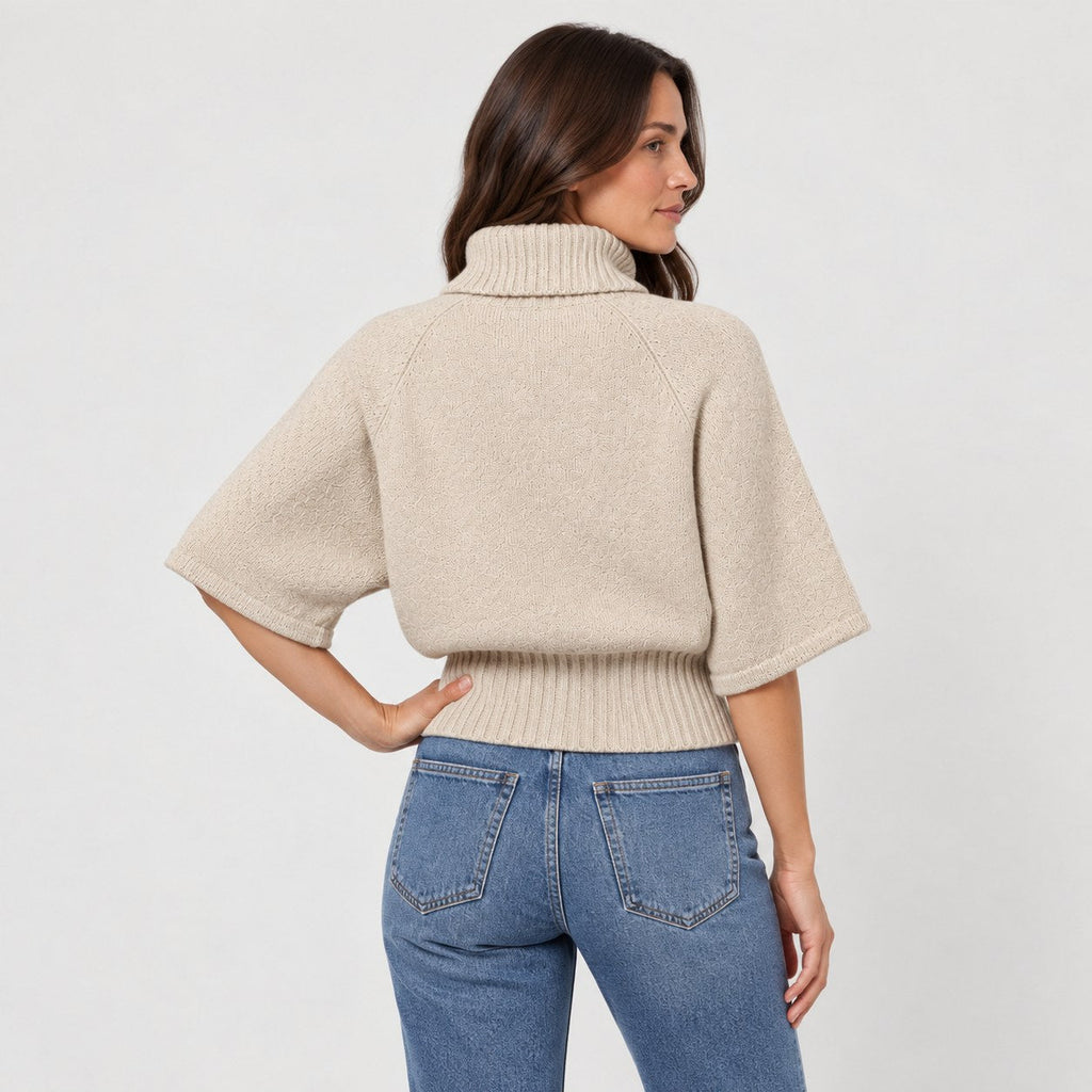 Women's cable knit turtleneck with cape sleeves in Beige | Grinton – back view
